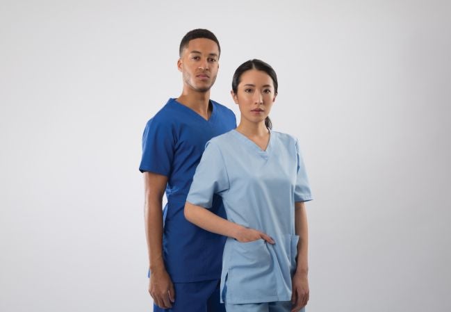 Two nurses wearing Alexandra Workwear scrubs Two nurses wearing Alexandra Workwear scrubs